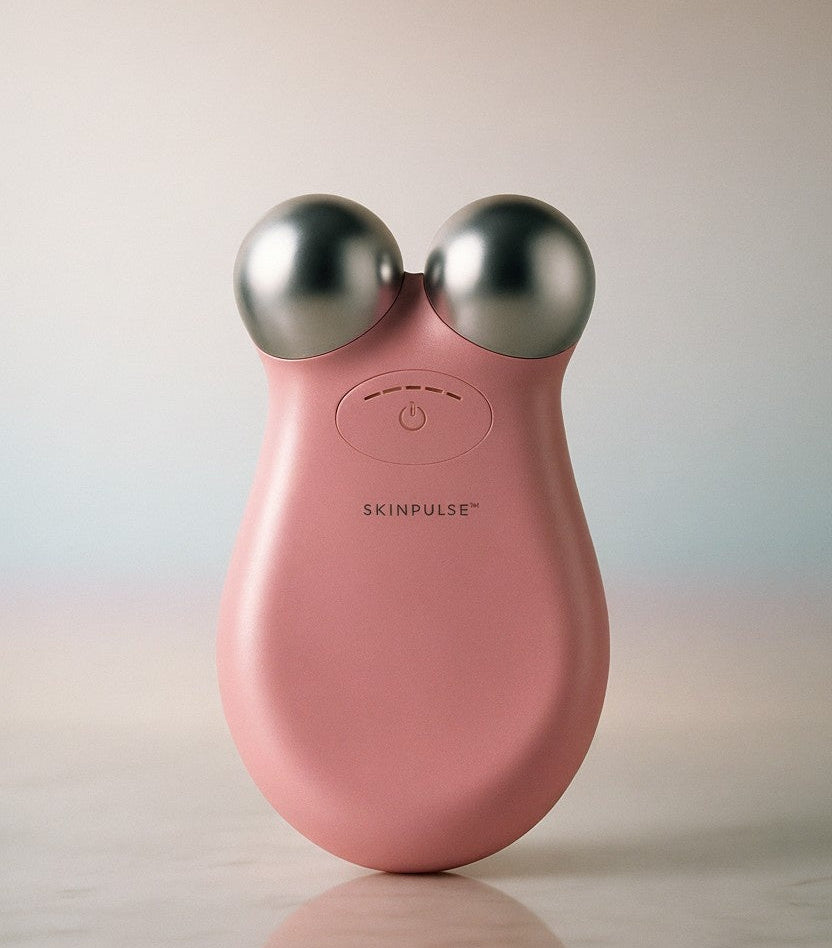 pink Zential PureSkinPulse device with silver knobs on a light background