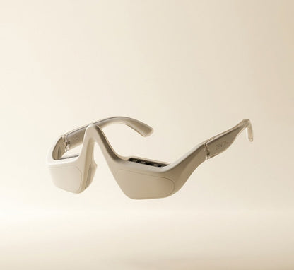 Sunglasses with a metallic finish on a beige background
