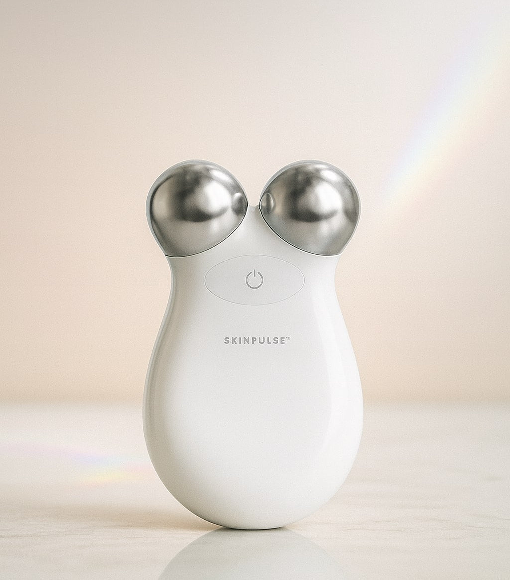 White electronic device with silver knobs on a reflective surface