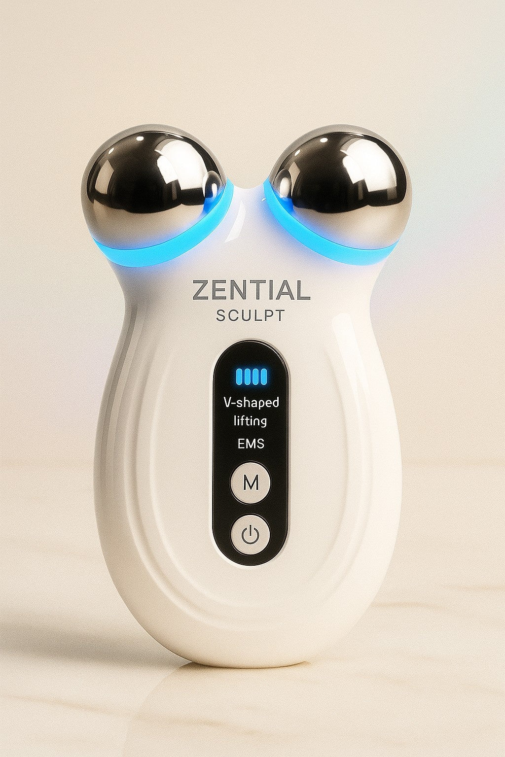 Zential EMS Sculpt device on a beige background